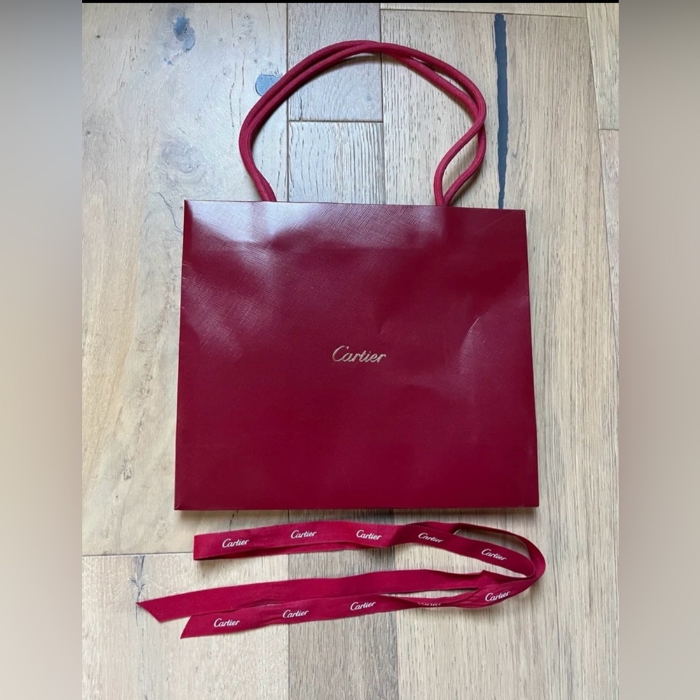 Cartier red and gold shopping bag and ribbon